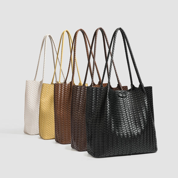 Large black basket-weave leather-look tote bag with long braided shoulder straps and matching woven zip pouch, detail view 2