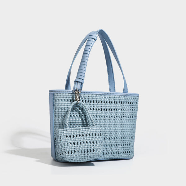 Structured open-weave tote bag with smooth leather-look trim, double top handles, detachable crossbody strap, and mini zip