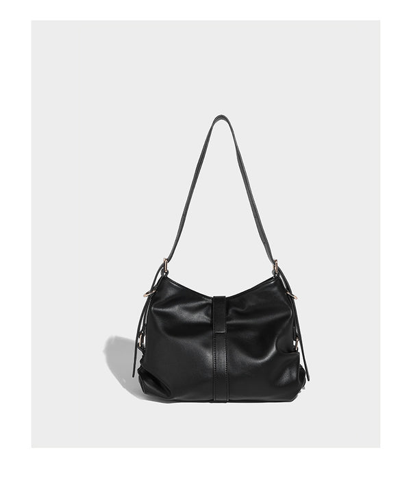 Soft slouchy hobo shoulder bag with smooth leather-look finish, gold-tone buckle and tab hardware, and long adjustable strap
