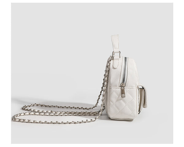 Compact diamond-quilted mini backpack handbag with silver-tone chain straps and turn-lock front pocket, detail view 14