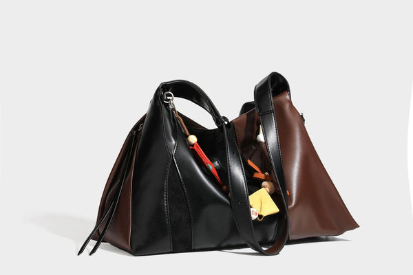 Two-tone black and brown leather-look slouchy shoulder bag with beaded tassel charm and silver-tone hardware, detail view 30
