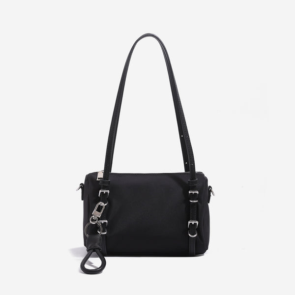 Compact nylon Boston barrel bag with zip-top closure, silver-tone hardware, dual slim handles, and detachable crossbody