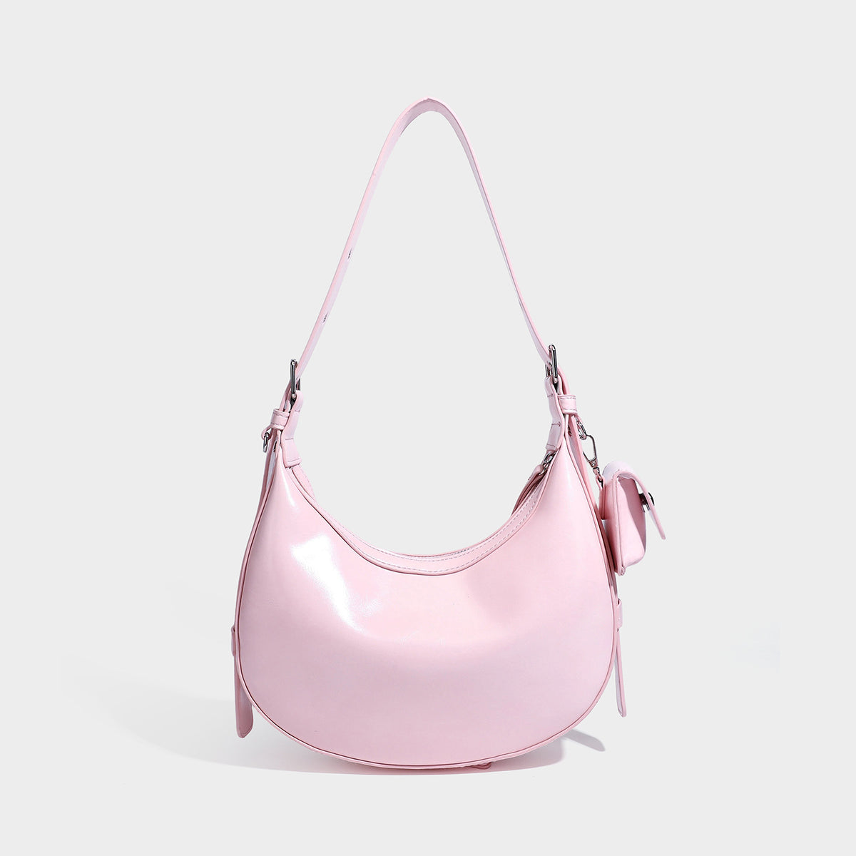 Glossy leather-look crescent hobo shoulder bag with dark contrast trim, silver-tone hardware, and attached mini flap pouch