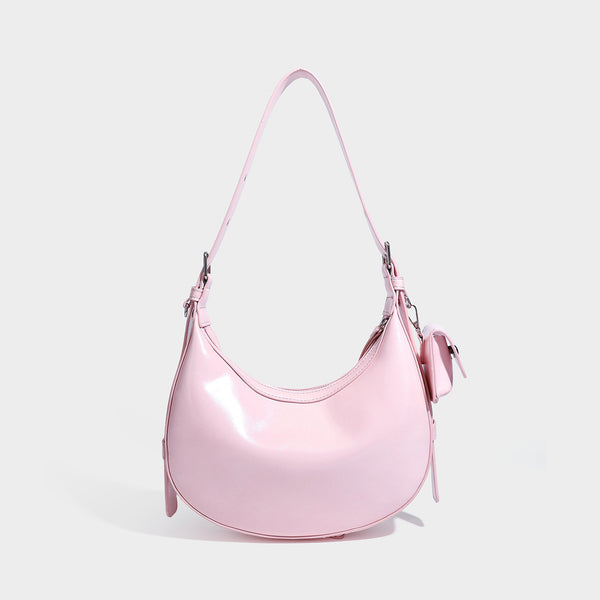 Glossy leather-look crescent hobo shoulder bag with dark contrast trim, silver-tone hardware, and attached mini flap pouch