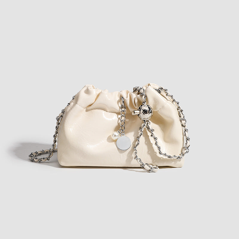 Small ruched drawstring bucket bag with twisted-link chain strap and pearl charm pull, detail view 8