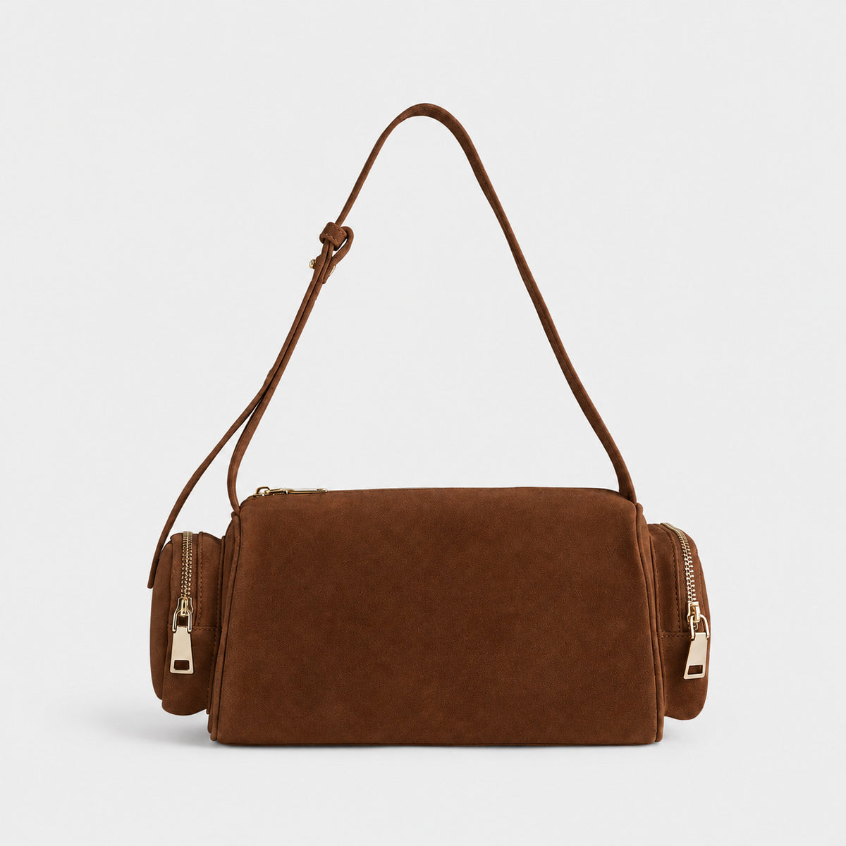 Mini barrel shoulder bag with side zip pouches and adjustable strap in pink suede-like finish, detail view 9