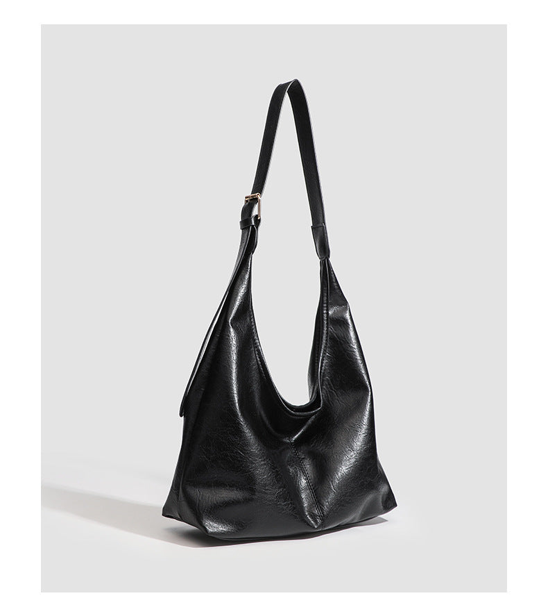 Large slouchy hobo shoulder bag in smooth leather-look finish with adjustable strap and gold-tone hardware, detail view 18