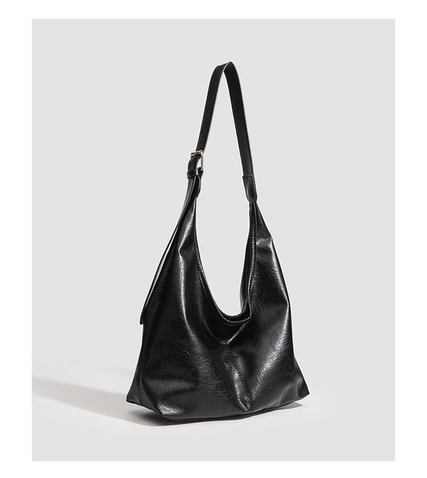 Large slouchy hobo shoulder bag in smooth leather-look finish with adjustable strap and gold-tone hardware, detail view 18