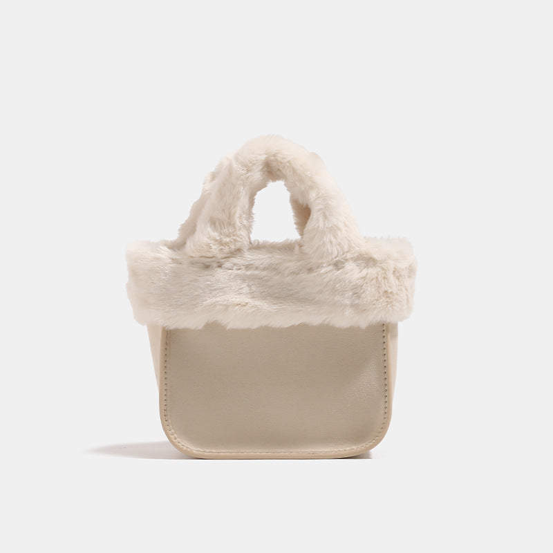 Mini structured handbag with cream faux-fur trim and suede-look textured body, shown with top handles and removable