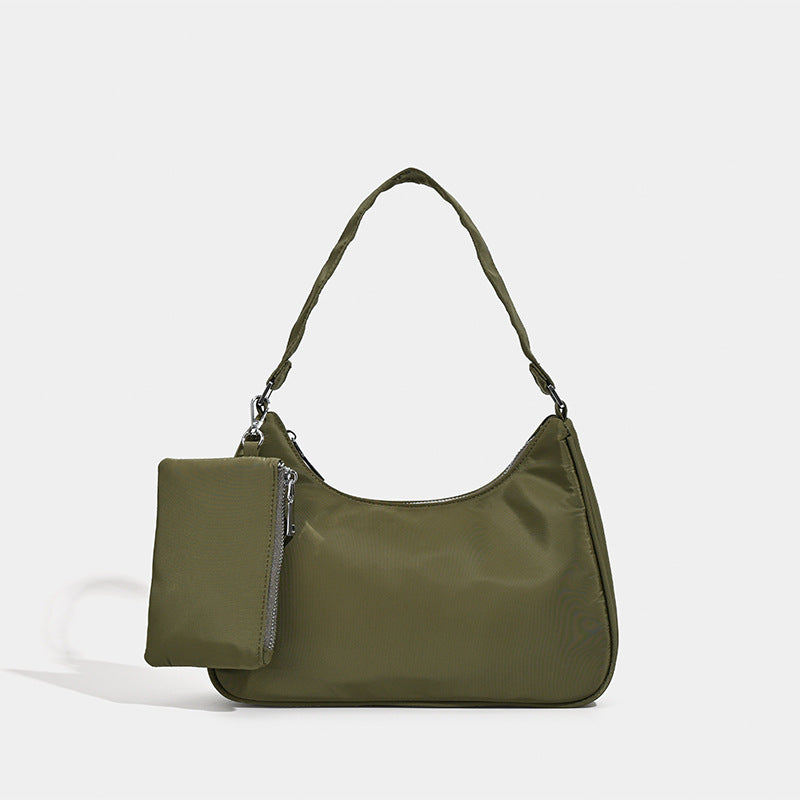 Curved hobo shoulder bag with detachable zip pouch in matte-satin finish with silver-tone hardware, detail view 7