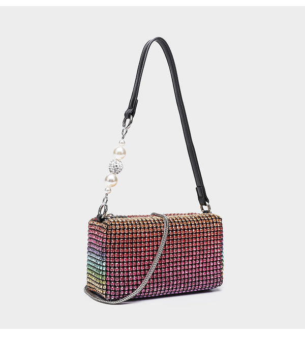 Small rectangular all-over rhinestone crossbody bag with pearl bead zipper pull and detachable silver chain strap, detail
