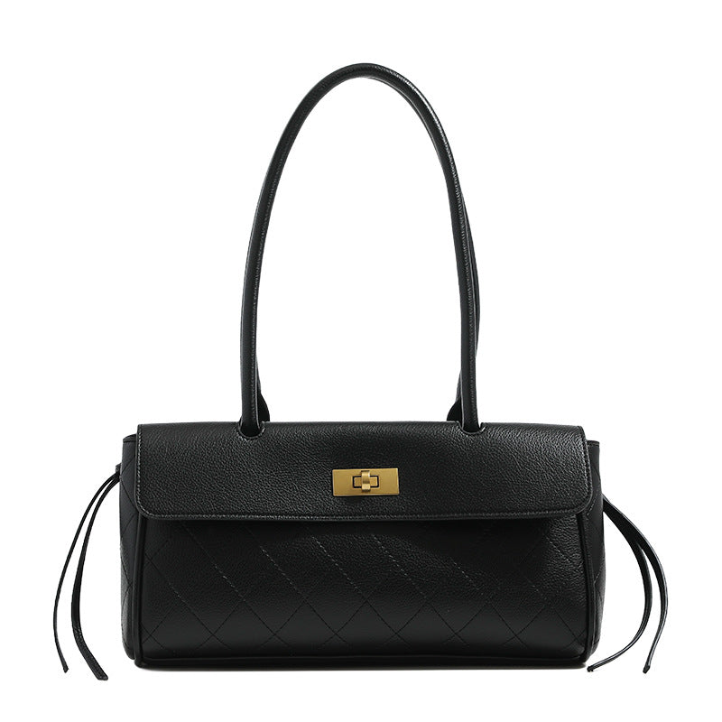 Structured quilted diamond-stitch baguette handbag with gold-tone turn-lock closure and dual top handles, detail view 5