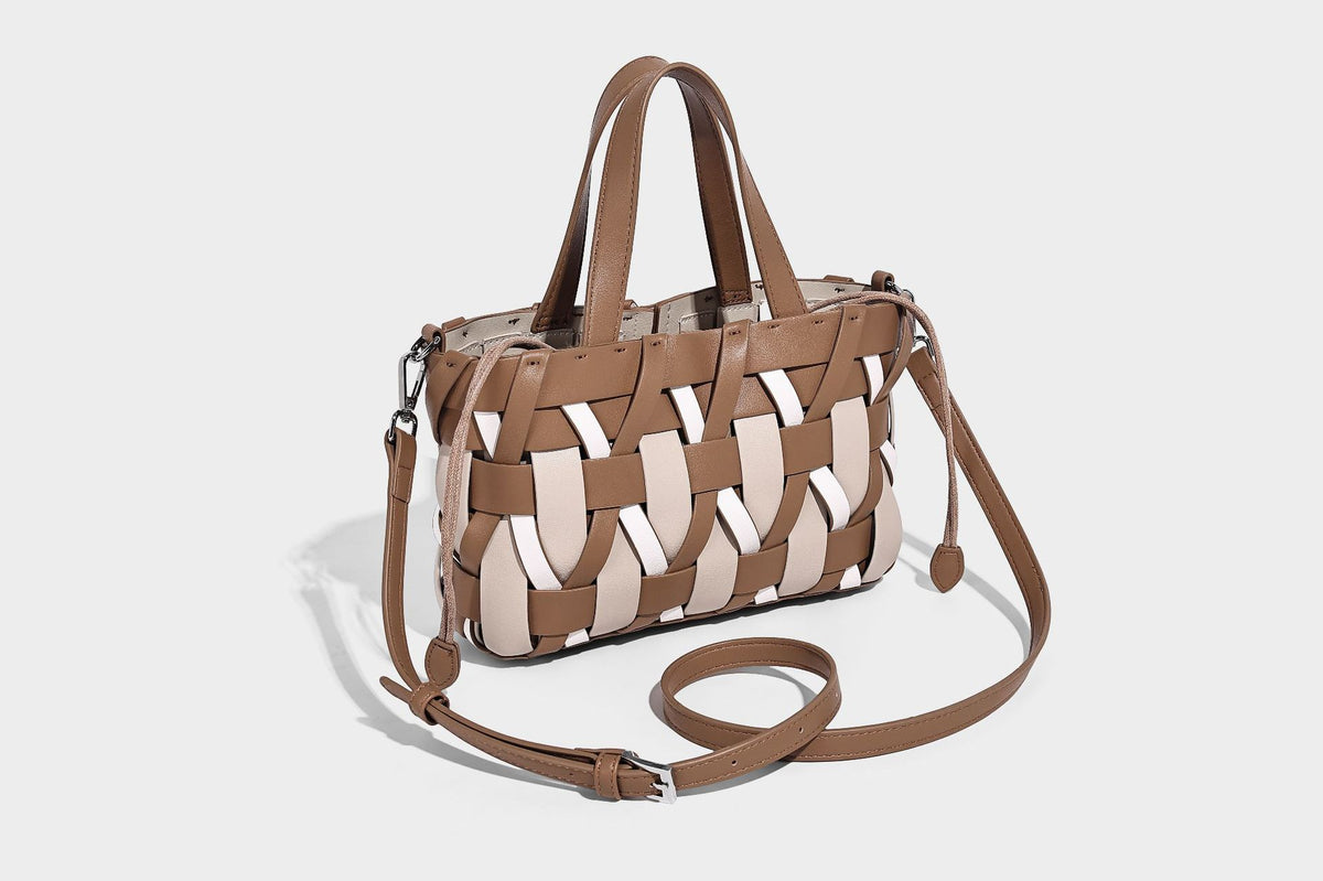 Small structured woven lattice tote bag with dual top handles and detachable shoulder strap in brown and cream leather-look