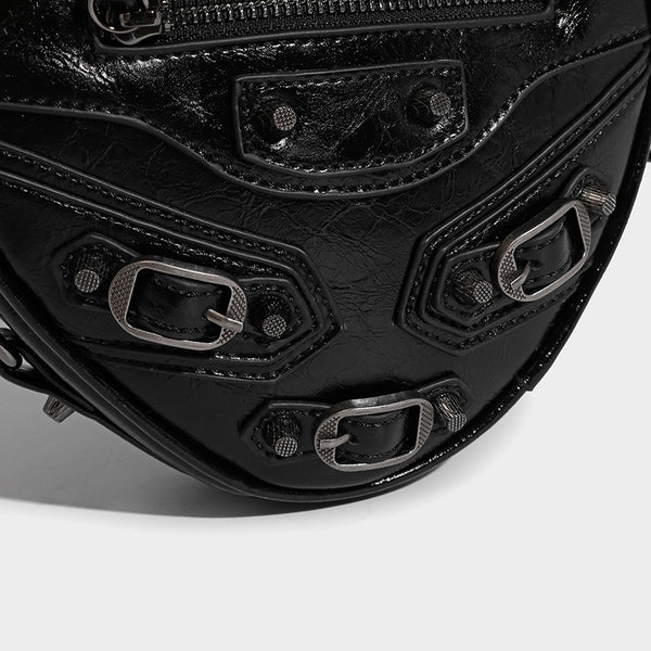 Mini heart-shaped crossbody bag with glossy crinkled finish and moto buckle hardware, detail view 24