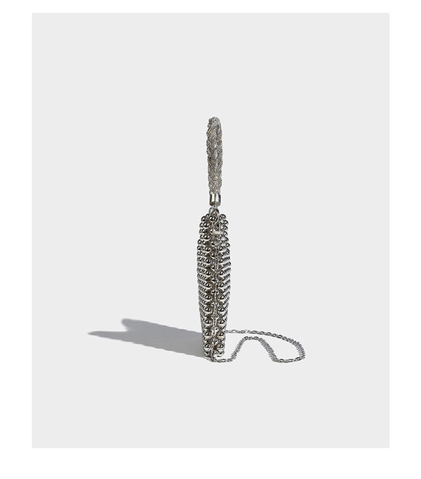 Small silver metallic beaded mini bag with braided rhinestone top handle and detachable chain crossbody strap, detail view 10