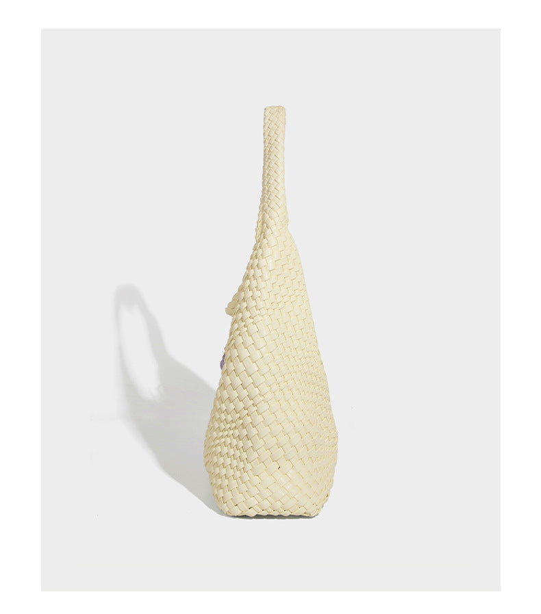 Soft hand-woven slouchy hobo tote bag with knotted tassel charm and single looped shoulder strap, detail view 26