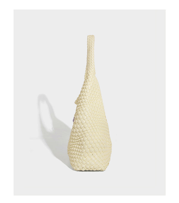 Soft hand-woven slouchy hobo tote bag with knotted tassel charm and single looped shoulder strap, detail view 26