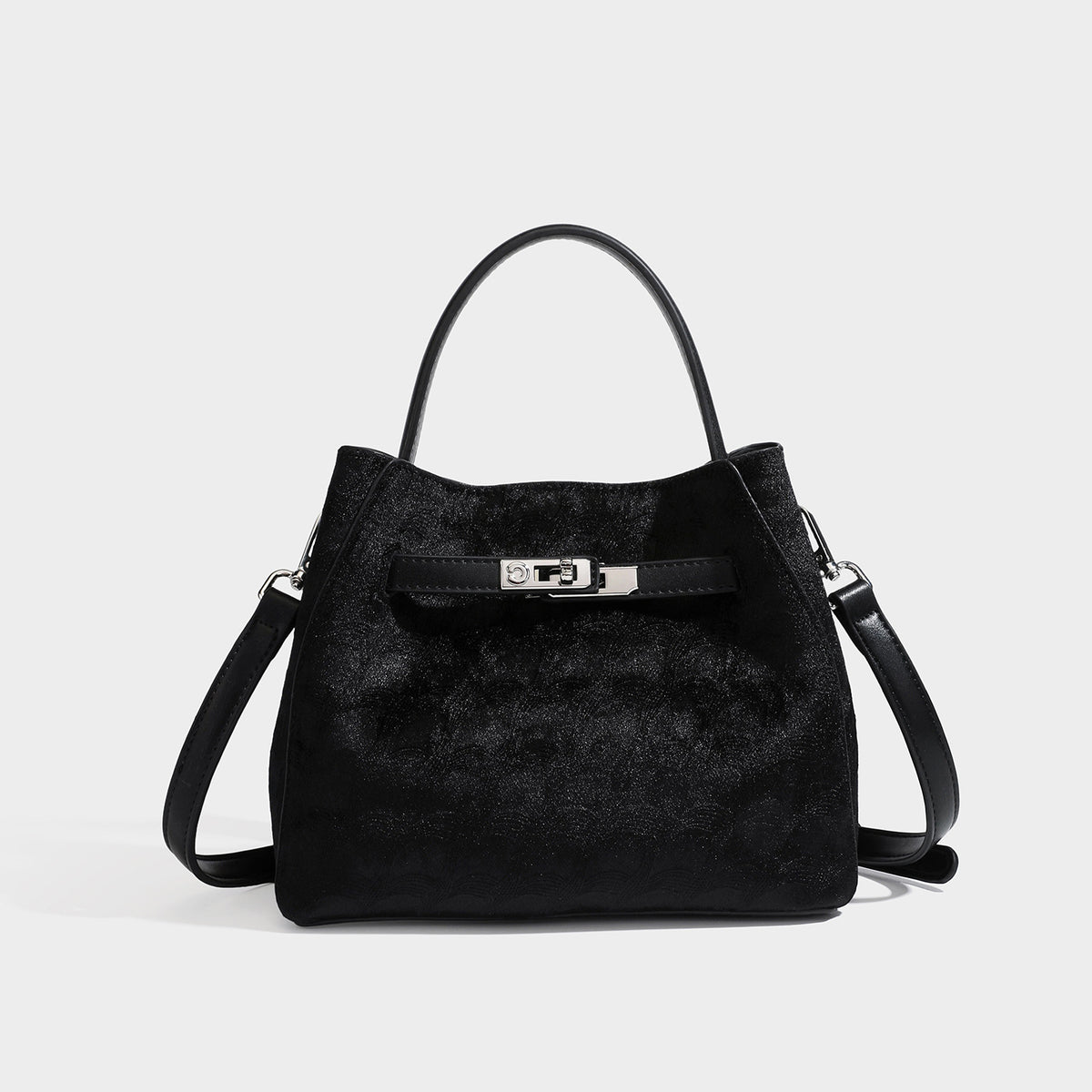 Small structured bucket satchel in embossed velvet-texture fabric with silver turn-lock hardware, rounded top handle, and