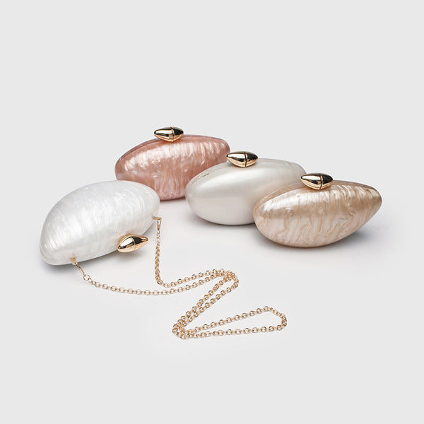 Oval hard-shell marbled gloss clutch bag with gold-tone kiss-lock clasp and detachable gold chain strap, detail view 2