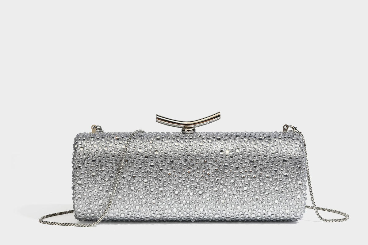 Structured rectangular hard-case clutch bag covered in all-over rhinestone crystal embellishment with curved kiss-lock top