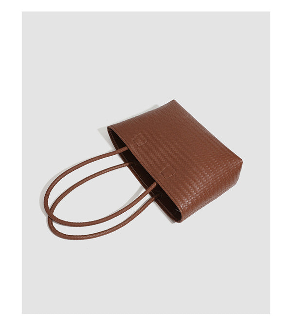 Structured cognac brown woven-texture tote bag with double top handles and open top, detail view 9