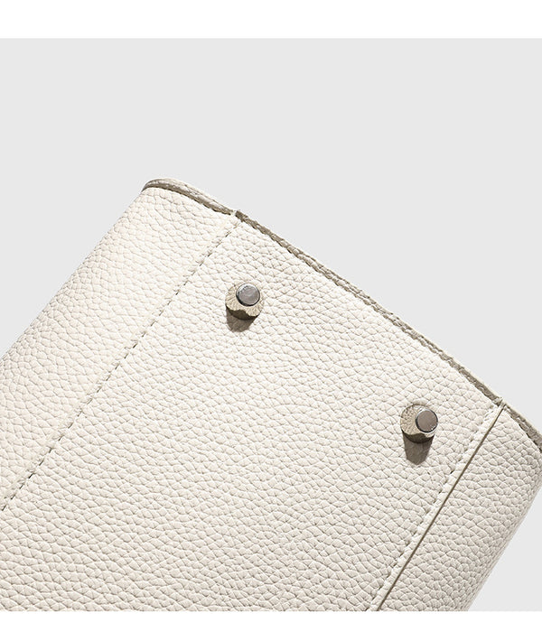 Large structured pebbled leather-look tote bag with double top handles and silver-tone hardware, detail view 16