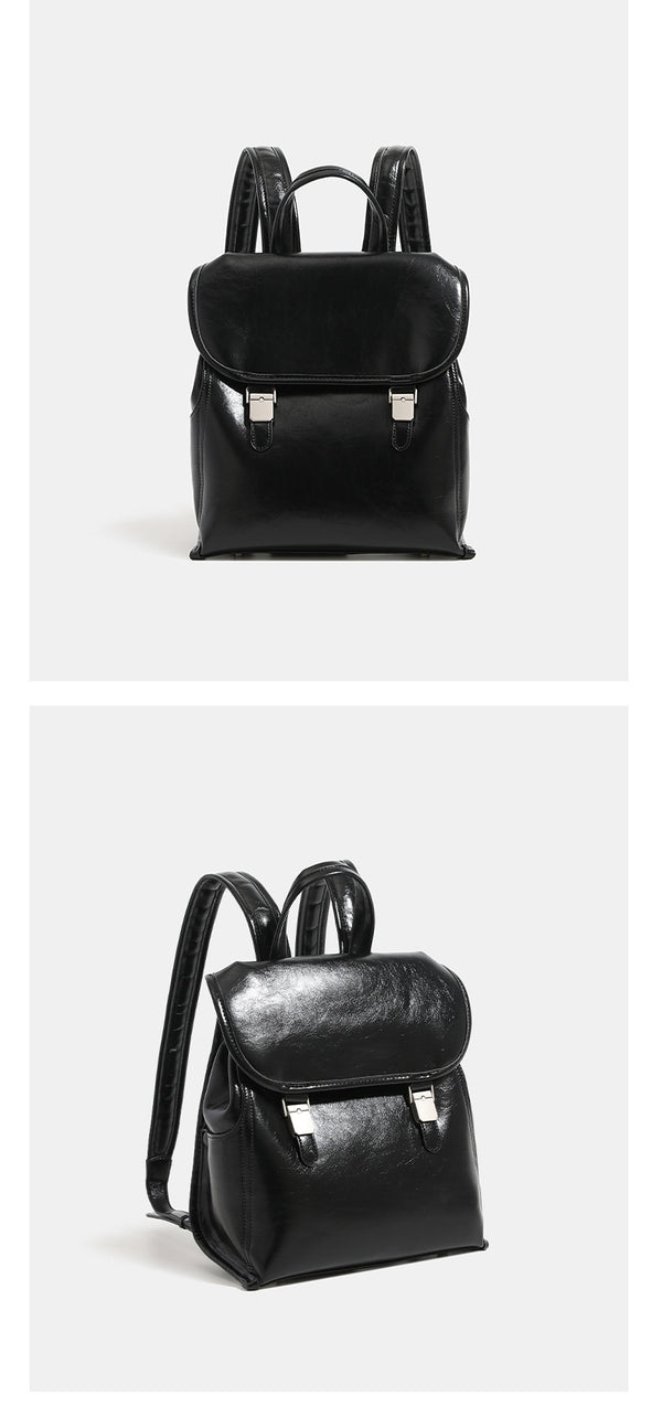 Structured glossy leather-look flap backpack with twin buckle closures and top grab handle, detail view 10