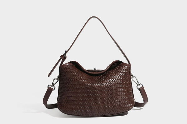 Small woven-look leather-look flap shoulder hobo bag in burgundy with silver-tone hardware and decorative tassel charm