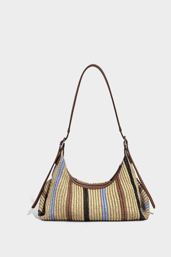 Slouchy woven straw hobo shoulder bag with beige, black, brown, and blue vertical stripes and brown leather-look trim, detail
