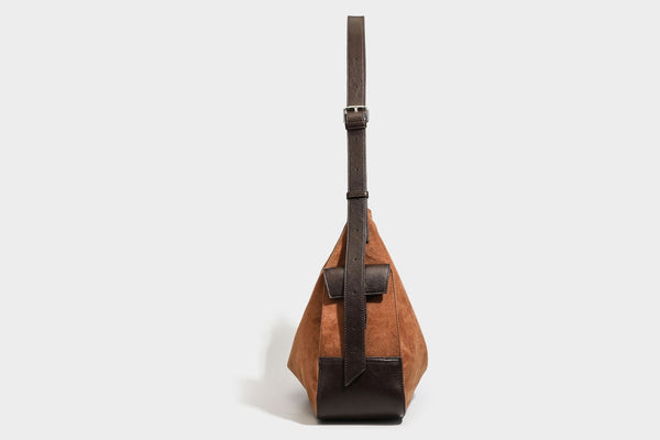 Slouchy cognac brown matte suede-look hobo shoulder bag with dark brown leather-look trim, top zip closure, front flap