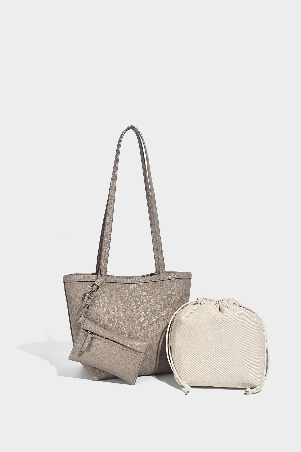 Structured pebbled leather-look tote bag in taupe with long shoulder strap, detachable zip pouch, and pink tulip flower