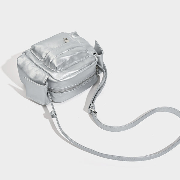 Boxy leather-look crossbody bag with front zip pockets, top zip closure, and long adjustable strap, detail view 4