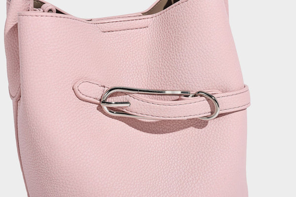 Mini pebbled leather-look bucket bag with front buckle strap, silver-tone hardware, top handle, and detachable shoulder