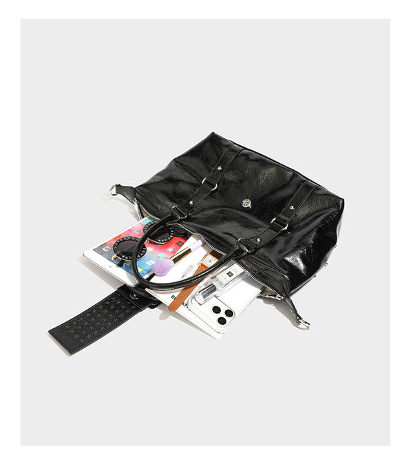 Glossy crinkled barrel handbag with silver stud buckle strap and detachable shoulder strap, detail view 13