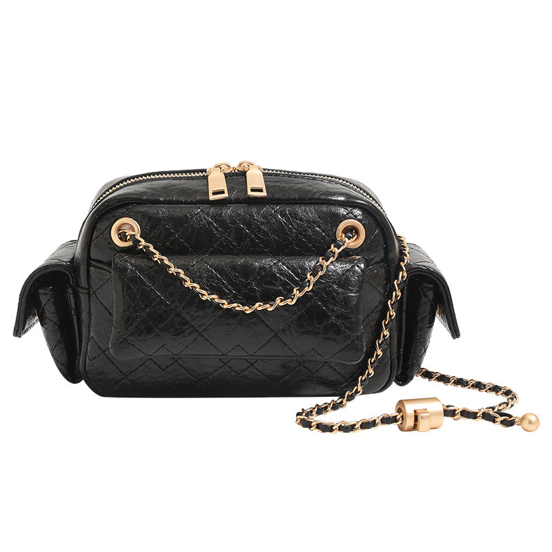 Compact quilted leather-look crossbody bag with gold-tone chain strap and double zip closure, detail view 5