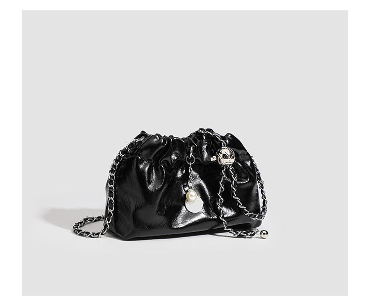 Small ruched drawstring bucket bag with twisted-link chain strap and pearl charm pull, detail view 14