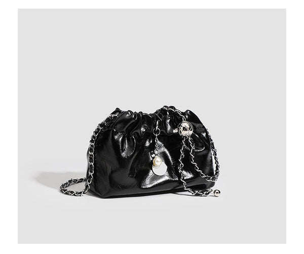 Small ruched drawstring bucket bag with twisted-link chain strap and pearl charm pull, detail view 14
