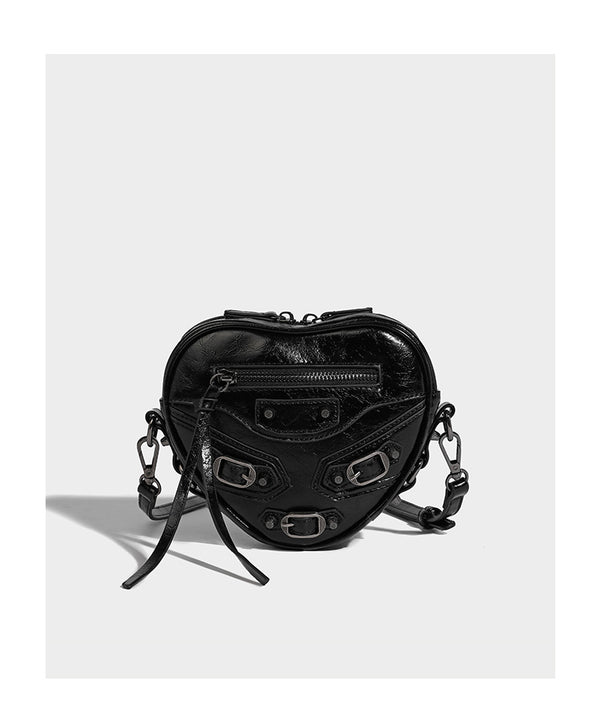 Mini heart-shaped crossbody bag with glossy crinkled finish and moto buckle hardware, detail view 9