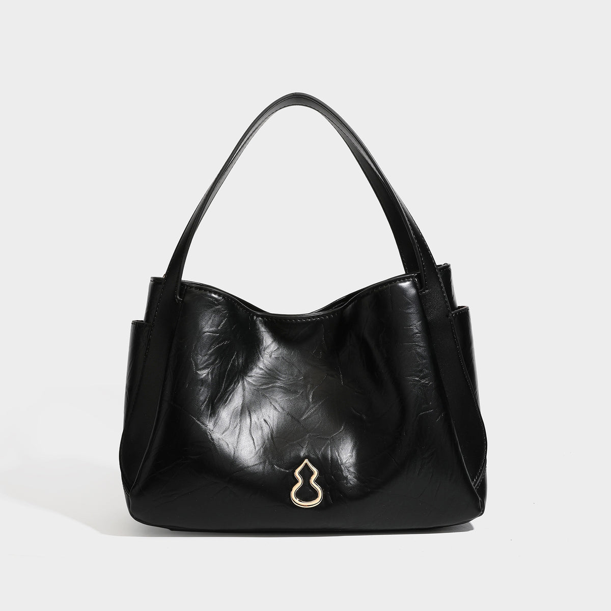 Black glossy crinkled leather-look convertible shoulder tote bag with gold gourd-shaped emblem hardware and detachable