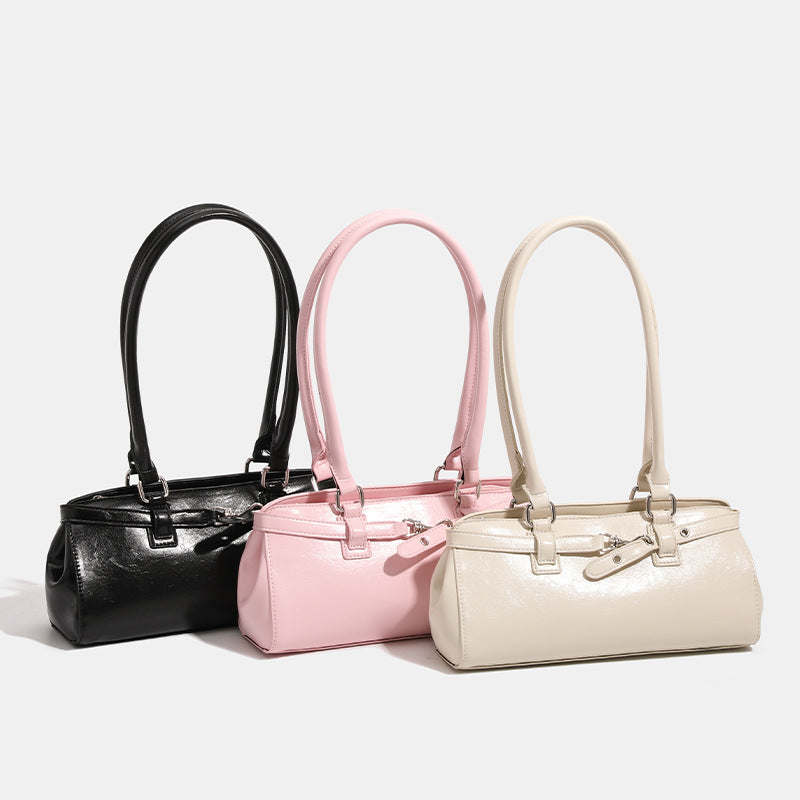 Glossy leather-look baguette shoulder bag with silver-tone hardware and buckle-strap detail, detail view 2