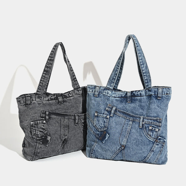 Large washed denim tote bag with jeans-style patch pocket and riveted seam detailing, double shoulder straps, open top