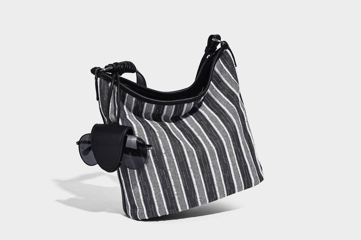 Large striped canvas hobo shoulder bag with cream trim and silver-tone hardware, detail view 8