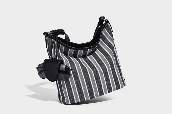 Large striped canvas hobo shoulder bag with cream trim and silver-tone hardware, detail view 8