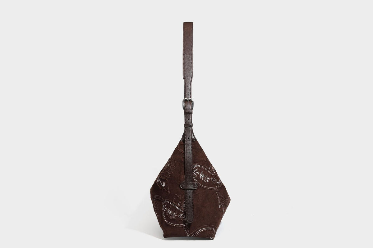 Deep chocolate suede-look hobo shoulder bag with tonal paisley floral embroidery, smooth dark leather-look trim, top zip