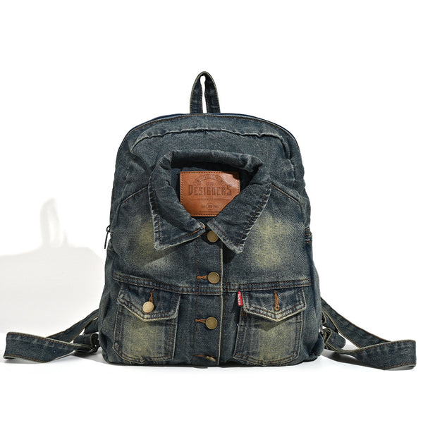 Vintage wash dark indigo denim backpack with jacket collar detail, snap buttons, patch pockets, and leather-look label
