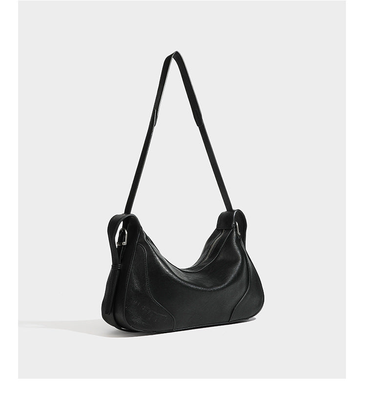 Dark brown curved zip-top hobo shoulder bag with slim adjustable strap and silver-tone hardware, detail view 18