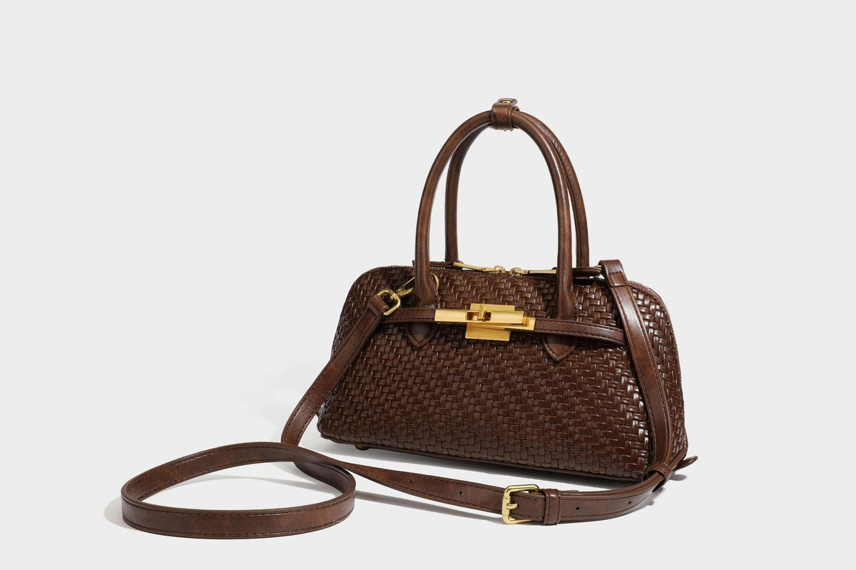 Structured woven-embossed leather-look satchel with dual rolled top handles, gold-tone turn-lock closure, and detachable