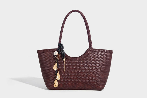 Large open-top woven tote bag with contrasting braided double handles and matching drawstring pouch, detail view 30