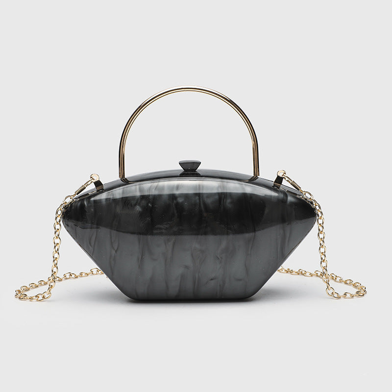 Shell-shaped pearlescent top-handle clutch bag with arched gold-tone metal handle and gold chain strap, detail view 8