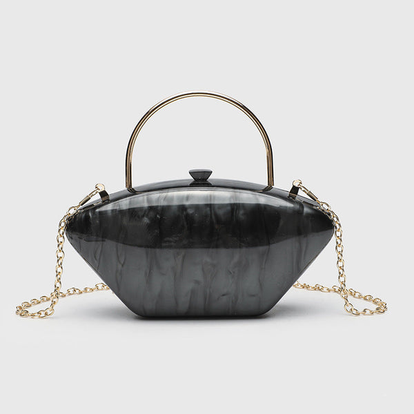 Shell-shaped pearlescent top-handle clutch bag with arched gold-tone metal handle and gold chain strap, detail view 8